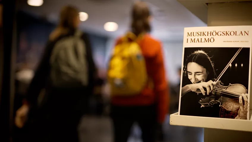 Two students in the academy's lobby. Photo.